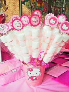 there are hello kitty candy sticks in the cup