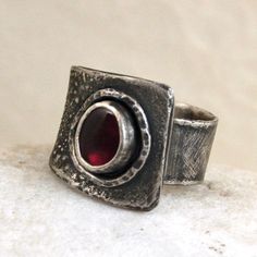 "Garnet silver ring. Dimensions: -stone 0.6 - 0.7 cm, 0.24 - 0.28\" -band width 0.9 - 1.7 cm, 0.35 - 0.67\" -size adjustable (please write me your size, I'll set it)." Silver Hand Forged Wide Band Open Ring, Silver Byzantine Gemstone Jewelry, Medieval Style Silver Rings For Anniversary, Medieval Style Silver Promise Ring, Sterling Silver Ruby Open Ring In Silver, Hand Forged Sterling Silver Ruby Ring, Silver Ruby Ring With Open Setting, Silver Ruby Open Ring Stamped 925, Silver Open Ruby Ring Stamped 925