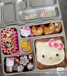 an open hello kitty lunch box with food in it