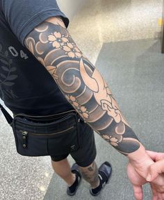 a man with a tattoo on his arm