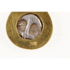 This is part of Chairish’s Fine Jewelry assortment.  An authentic Greek Apollonia Pontika, AR Drachm Coin (Thrace, circa 450-400 BC), set in a rounded form 22k gold bezel with 22k gold drop linked chain and bail. The obverse, or front, side of this coin features the head of Gorgoneion with a protruding tongue, surrounded by serpents. On the reverse side, an upturned anchor with an "A" and a crayfish. This coin has been inspected and approved to be authentic by a professional Numismatic who speci Ancient Style Yellow Gold Brass Jewelry, Gold Byzantine Jewelry With Intaglio Details, Ancient Style Gold Ceremonial Jewelry, Ancient Gold Jewelry For Ceremonial Occasion, 22k Gold Byzantine Jewelry For Formal Occasions, Ancient Style Gold Jewelry For Ceremonial Occasion, Formal 22k Gold Byzantine Jewelry, Gold Vintage Jewelry For Formal Occasions, Gold Byzantine Jewelry With Bezel Setting