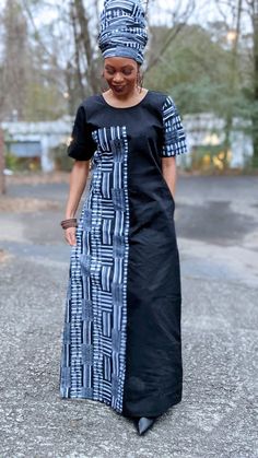 With its unique asymmetric designed sleeves, this seriously pretty Black and White Kente maxi dress is one you'll want to hold on to for a looong time. 100% Cotton. Delicate wash, hang dry or dry clean Imported from Africa This maxi dress goes well with heels and handbag Asymmetric design adds a unique and chic look to your appearance model is 5'3 pull over head wrap not included, sold separately DP0795, DPB0795 African Print Long Dress, Kente Dress, African Fabric Dress, Long African Dresses, African Print Dress Ankara, African Dresses Modern, Afrikaanse Mode, African Wear Dresses, African Print Dress Designs