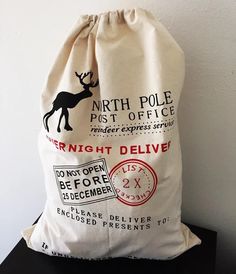 a bag that is sitting on top of a black table next to a white wall