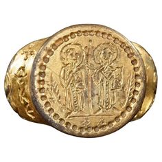 A large silver gilt Byzantine ring from the middle to later Empire. The bezel shows saints Peter and Paul standing by a processional cross, both holding bibles. Note the shoulders of the cross are the words "God save or preserve. Silver with gilding. Byzantine 8/10th.c.A.D. Size : 8 1/2 Weight: 44.1 gr. Saints Peter And Paul, Byzantine Ring, Byzantine Rings, St Peter And Paul, Saint Peter, Signet Ring, Jewelry Rings, Bible, Ring