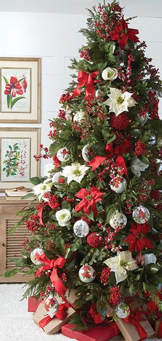 a decorated christmas tree with red and white ornaments