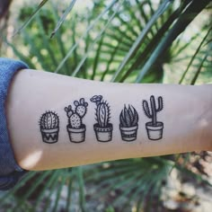 a person's arm with a tattoo on it that has different kinds of plants in pots