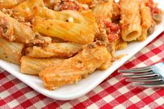 pasta with meat and sauce on a white plate