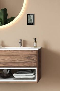 a bathroom vanity with a mirror above it