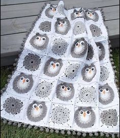 a crocheted blanket with owls on it