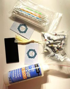 the contents of a craft kit including toothbrushes and glue