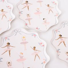 four pink and white ballerina coasters with ballet images on them