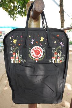 Welcome to our charming collection of hand-embroidered Fjallraven Kanken backpacks, meticulously crafted with love and precision. Elevate your style and stay organized on-the-go with these premium quality backpacks available in two convenient sizes:  - Medium (27x38x13cm)  - Large (32x42x13cm) + Key Features: - Hand-Embroidered Excellence: Each Fjallraven Kanken backpack is adorned with exquisite hand-embroidery, creating a unique and exclusive piece that sets you apart from the crowd. - Premium Embroidered Kanken, Kanken Embroidery, Fjallraven Backpack, Mochila Fjallraven Kanken, Mushrooms Forest, Kanken Classic, Backpack Fjallraven, Embroidered Backpack, Embroidery Bags