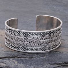 Tightly braided silver wires are flanked by rippling helixes on this cuff bracelet from Pakaon Sojintarit in Thailand. Karen hill tribe artisans craft the wide cuff from sterling silver. Traditional Silver Braided Bangle Bracelet, Silver Braided Bohemian Bracelets, Bohemian Silver Braided Bracelet, Adjustable Interwoven Bracelets As Gift, Silver Braided Hand-wrapped Bangle Bracelet, Silver Hand-wrapped Braided Bangle Bracelet, Silver Braided Bangle Bracelets, Silver Hand Wrapped Braided Bangle Bracelet, Hand-wrapped Silver Braided Bangle Bracelet