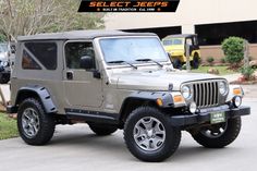 a jeep parked in front of a building