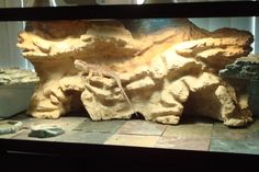 an aquarium with rocks and water in it