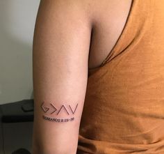 a woman with a tattoo on her arm that reads vak and the word love is in roman numerals