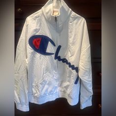 Champion Printed Logo Windbreaker Jacket White Size Large Kids Never Worn White Long Sleeve Windbreaker For Winter, White Sweatshirt With Pockets For Outdoor, White Outdoor Sweatshirt With Pockets, White Cotton Long Sleeve Windbreaker, White Hooded Track Jacket With Pockets, White Long Sleeve Track Jacket For Outdoor, Boys Winter Jackets, Kids Jackets, Hooded Winter Coat