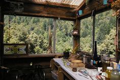 an outdoor kitchen with lots of cooking utensils on the counter and in the ceiling