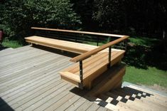 a wooden bench sitting on top of a wooden deck