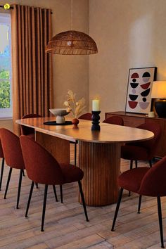 a dining room table with chairs around it