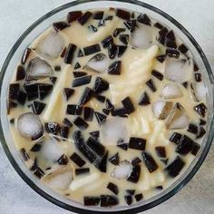 a glass bowl filled with ice and liquid