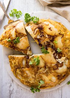 an omelet is cut into slices on a plate