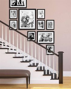 a stair case with many pictures on the wall