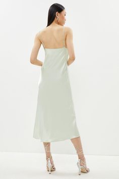 Live out your Nineties style dream in this silky satin slip dress. Detailed with a draped cowl neckline and slender spaghetti straps, this slinky, curve-skimming design is sure to turn heads at every summer soiree.Style: Slip DressDesign: PlainFabric: SatinLength: MidiNeckline: CowlSleeve Length: Sleeveless Cowl Neck Midi Dress, Dresses Satin, Summer Soiree, Cowl Neckline, Dress Satin, Satin Slip Dress, Satin Slip, Cowl Neck, Spaghetti Strap