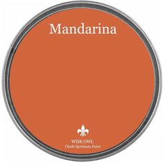 an orange tin with the words mandarna on it in white lettering and a silver rim