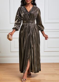 a woman in a metallic dress standing on a wooden floor