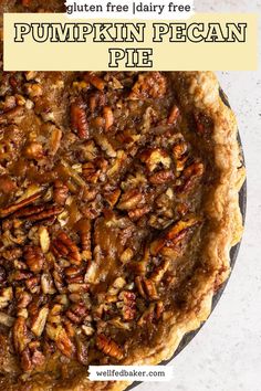 A freshly baked gluten free pumpkin pecan pie sitting on a white table. Gluten Free Pecan Pumpkin Pie, Gluten And Dairy Free Pecan Pie, Raw Pecan Pie, Pecan Pie Recipe Dairy Free, Gluten Free Pumpkin Pecan Pie, Dairy Free Pecan Pie Recipe, Dairy And Gluten Free Thanksgiving Desserts, Gf Df Pecan Pie, Dairy Free Gluten Free Pumpkin Pie