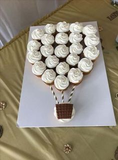 cupcakes are arranged in the shape of a hot air balloon