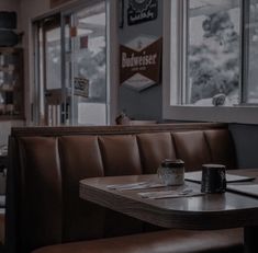 the inside of a restaurant with tables and booths