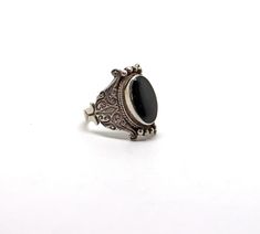 "The workmanship on this ring is truly beautiful. I love the setting and the way it lays so comfortably on the finger. Set with black onyx in unmarked sterling silver. The top measures 7/8\" by 1/2\". Not a Native American made product." Black Oval Engraved Sterling Silver Ring, Oval Black Sterling Silver Engraved Ring, Black Vintage Engraved Ring Stamped 925, Vintage Black Engraved Ring Stamped 925, Black Onyx Ring, Onyx Ring, Ring Sterling Silver, American Made, Sterling Ring