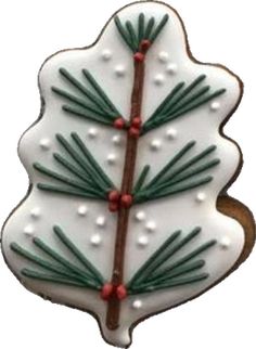 a decorated christmas tree cookie on a white background