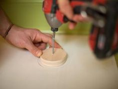 a person using a drilldriver on a piece of wood