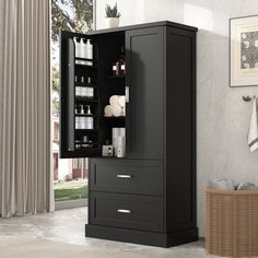 an armoire with two drawers in a room