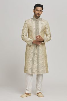 Ivory sherwani with floral embroidery. Paired with an inner kurta and pyjama. - Aza Fashions Ceremonial Bollywood Cream Churidar, Ceremonial Beige Kurta With Naqshi, Ceremonial Beige Kurta With Zari Work, Beige Naqshi Kurta For Ceremonial Occasions, Beige Dabka Sherwani Straight Kurta, Bollywood Style Cream Kurta For Ceremonial Occasions, Bollywood Style Cream Sherwani With Straight Kurta, Gold Sherwani With Chikankari Embroidery, Beige Sherwani With Chikankari Embroidery For Diwali