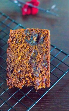 a piece of cake sitting on top of a cooling rack