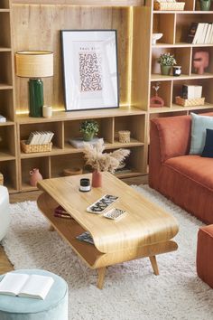 a living room filled with furniture and bookshelves