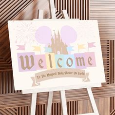 a welcome sign with a castle in the background and fireworks coming out of it's top