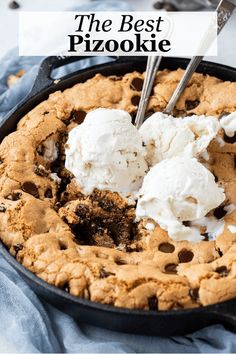 the best chocolate chip cookie is topped with ice cream and oreo chips in a cast iron skillet