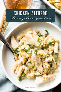 chicken alfredo with peas in a white bowl