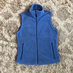 Columbia Sportswear Light Blue Periwinkle Vest Soft Fleece Zipper Pockets And Zipper Opening Small Nwot Never Worn Blue Fleece Jacket For Sports, Blue Fleece Jacket With Pockets For Sports, Blue Fleece Sports Outerwear, Blue Fleece Jacket With Fleece Lining For Sports, Blue Winter Hiking Fleece Jacket, Casual Blue Fleece Jacket For Outdoor Activities, Blue Fleece Jacket For Hiking In Fall, Blue Periwinkle, Zipper Vest