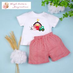 This Down on the Farm shorts set is so darn cute! With cute farm-themed items skillfully appliqued on the chest -- a tractor, stalks of corn, a barn with a rooster, and a cute little cow. Makes for a great gift. ------ Thank you for supporting my small business! Making and sourcing adorable, timeless clothes for your little one is a passion and hobby of mine. Be sure to follow and tag us on social media: 🌸 FB: High Cotton Magnolias 🌸 IG: @HighCottonMagnolias Elizabeth High Cotton Magnolias Casual Cotton Gingham Sets, Casual Gingham Cotton Sets, Cute Cotton Sets With Shorts, Cute Cotton Short Sets, Summer Gingham Short Sleeve Sets, Summer Gingham Sets With Short Sleeves, Cute Gingham Cotton Bottoms, Cute Gingham Cotton Sets, Cute Cotton Shorts For Playtime