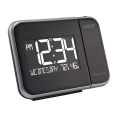 an alarm clock with the time at 3 45 pm on it's display is shown