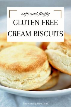 two biscuits sitting in a white bowl on top of a table