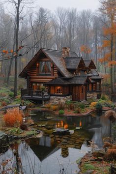 a log cabin sits in the woods next to a pond