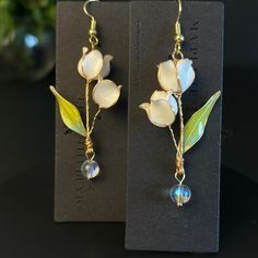 Discover the enchanting beauty of our Lily of the Valley earrings, the perfect homage to May's birth flower. These exquisite long flower earrings are not just a piece of jewelry; they're a celebration of elegance, making them an ideal choice for bridal wear or a thoughtful Mother's Day gift. Each pair is delicately crafted, embodying the essence of spring and renewal, perfect for teachers, brides, or anyone looking to add a touch of floral grace to their ensemble. Whether you're seeking a unique piece to commemorate a birthday, elevate a wedding look, or embrace the whimsical charm of fairy-inspired accessories, our Korean-style Lily of the Valley earrings are a timeless choice that blends tradition with contemporary design. . . . . . . . . . . . . . . . . . . . . . . . . . . . . . . . . . Lily Of The Valley Accessories, Kawaii Wedding, Nature Fairy, May Birth Flowers, Lily Of The Valley Flowers, Valley Flowers, Diy Jewelry Unique, Jewelry Cute, Etsy Bridesmaid Gifts