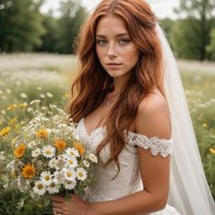 a woman in a wedding dress holding a bouquet of daisies and looking at the camera